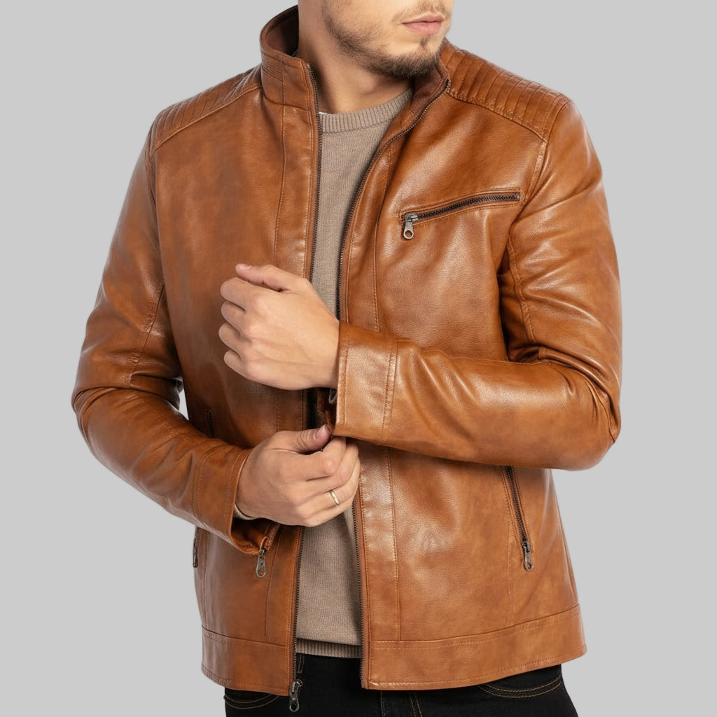 Brown leather jacket worn by a person on a white background