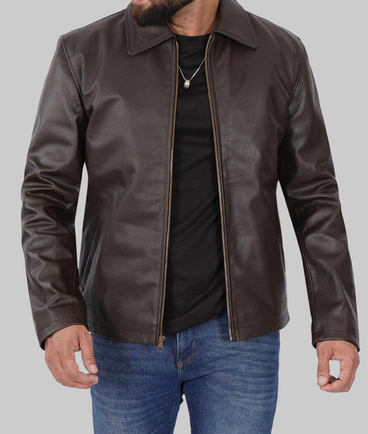 Man wearing a brown leather jacket over a black shirt with a white background