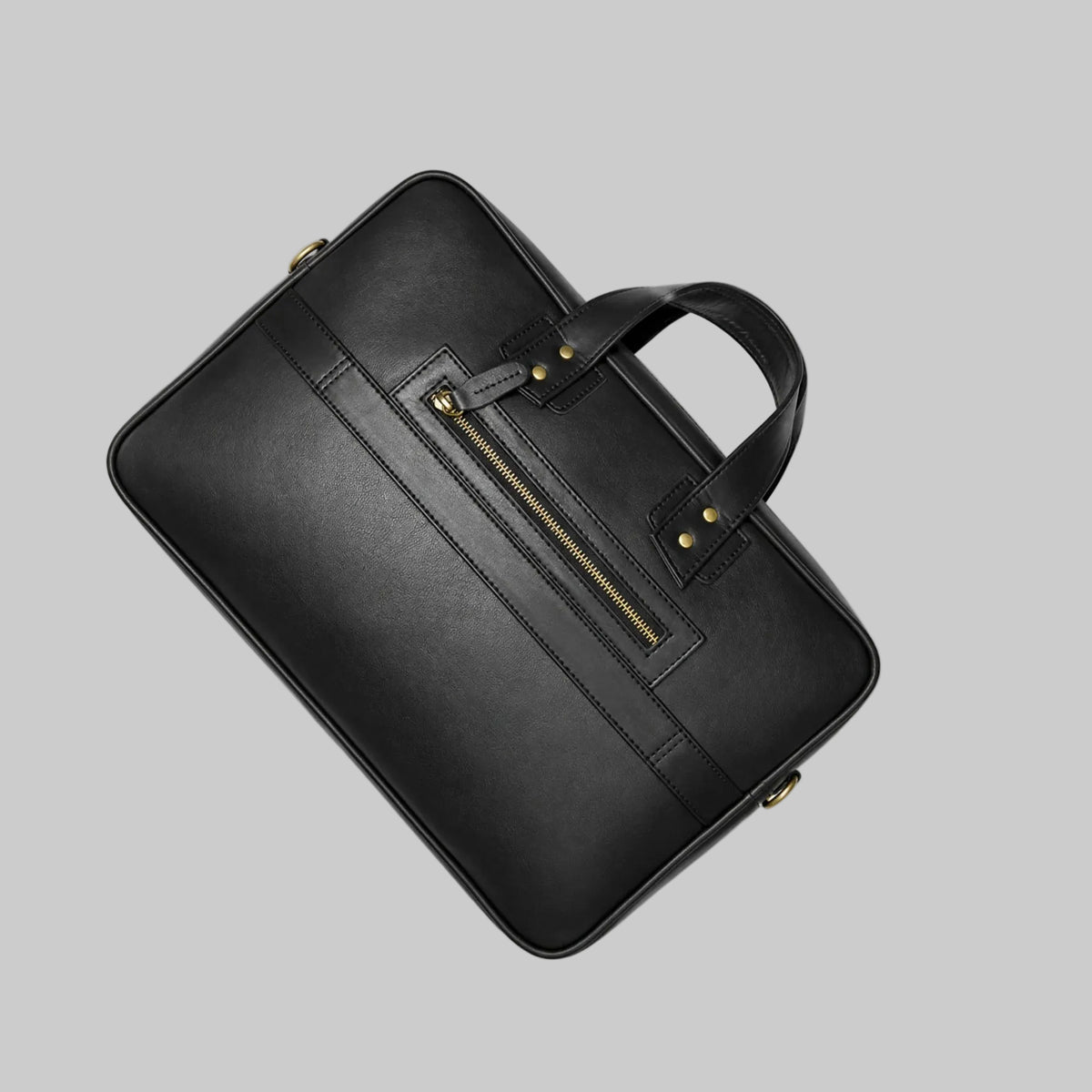 Black leather briefcase with gold zipper on a white background