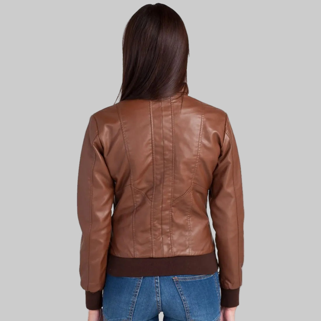 Brown leather jacket worn by a person on a white background