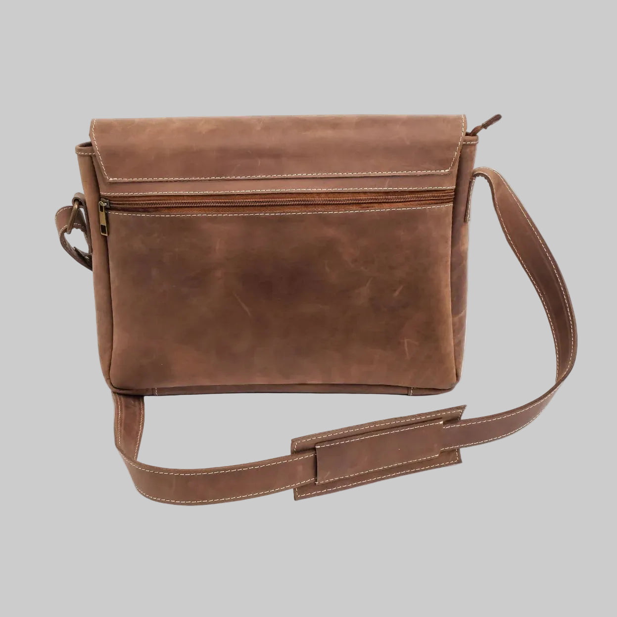 Brown leather messenger bag on a white background