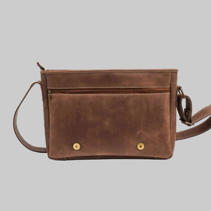 Brown leather crossbody bag on a white background