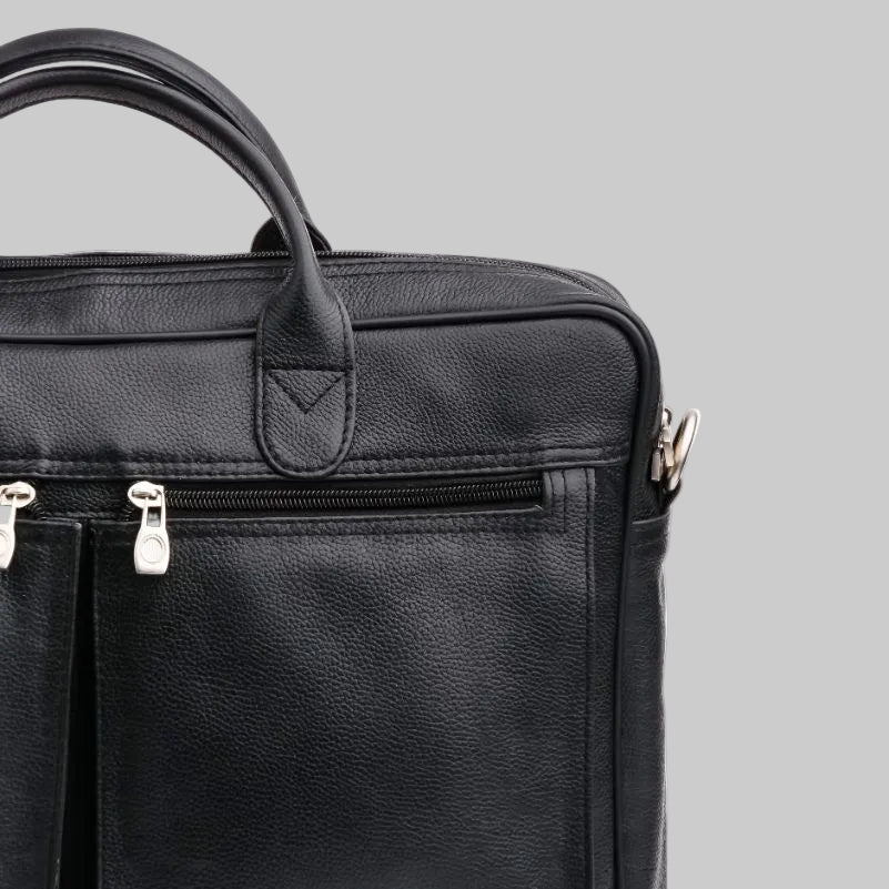 Black leather briefcase with zippers on a white background