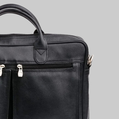 Black leather briefcase with zippers on a white background