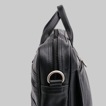 Black leather bag with a handle on a white background