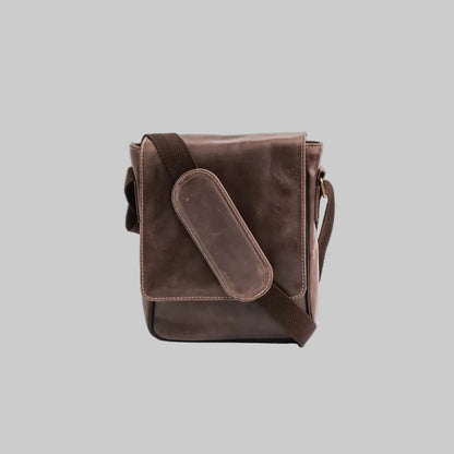 Brown leather crossbody bag on a white background