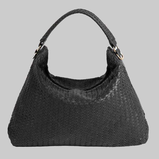 Black woven handbag on a white background