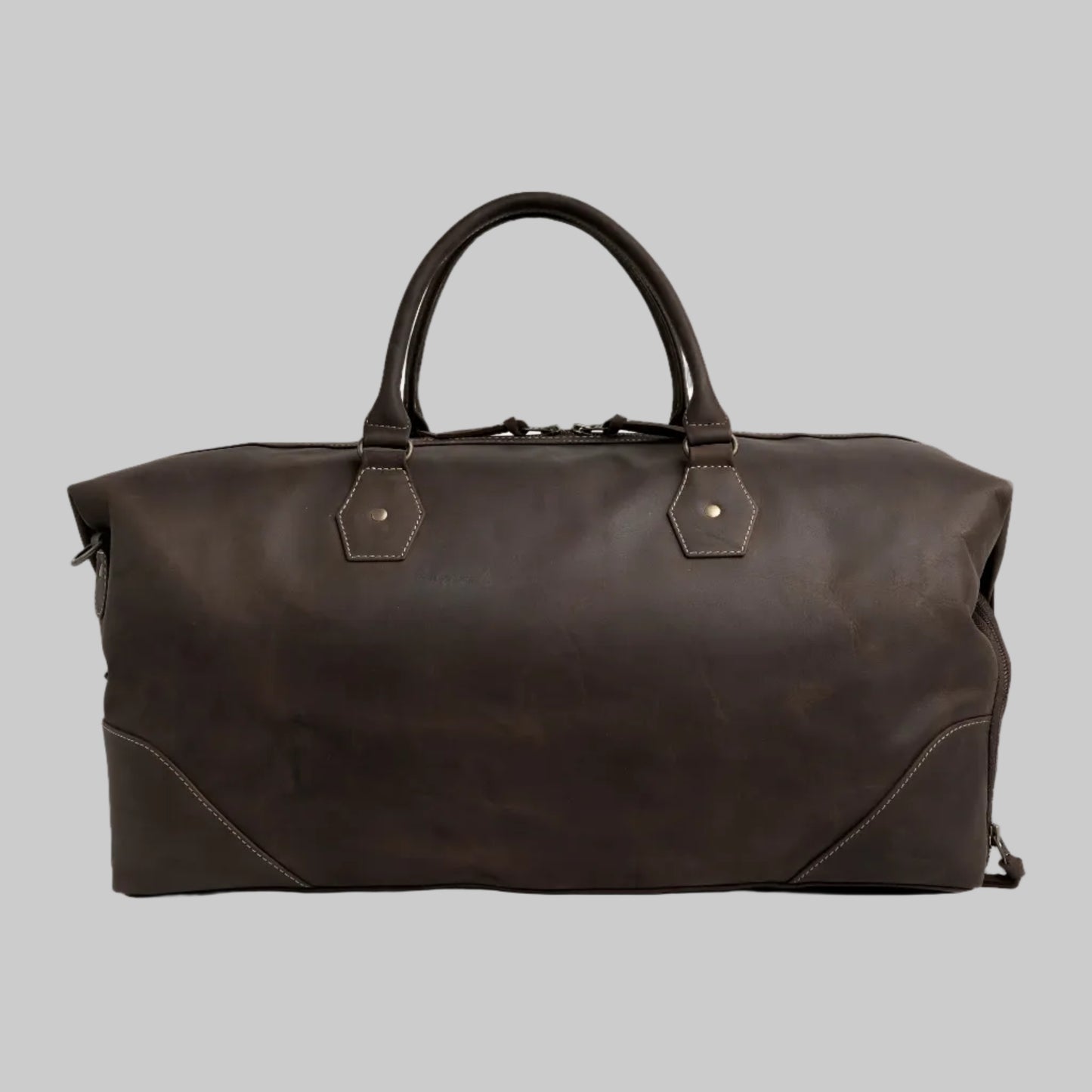 Brown leather duffel bag on a white background