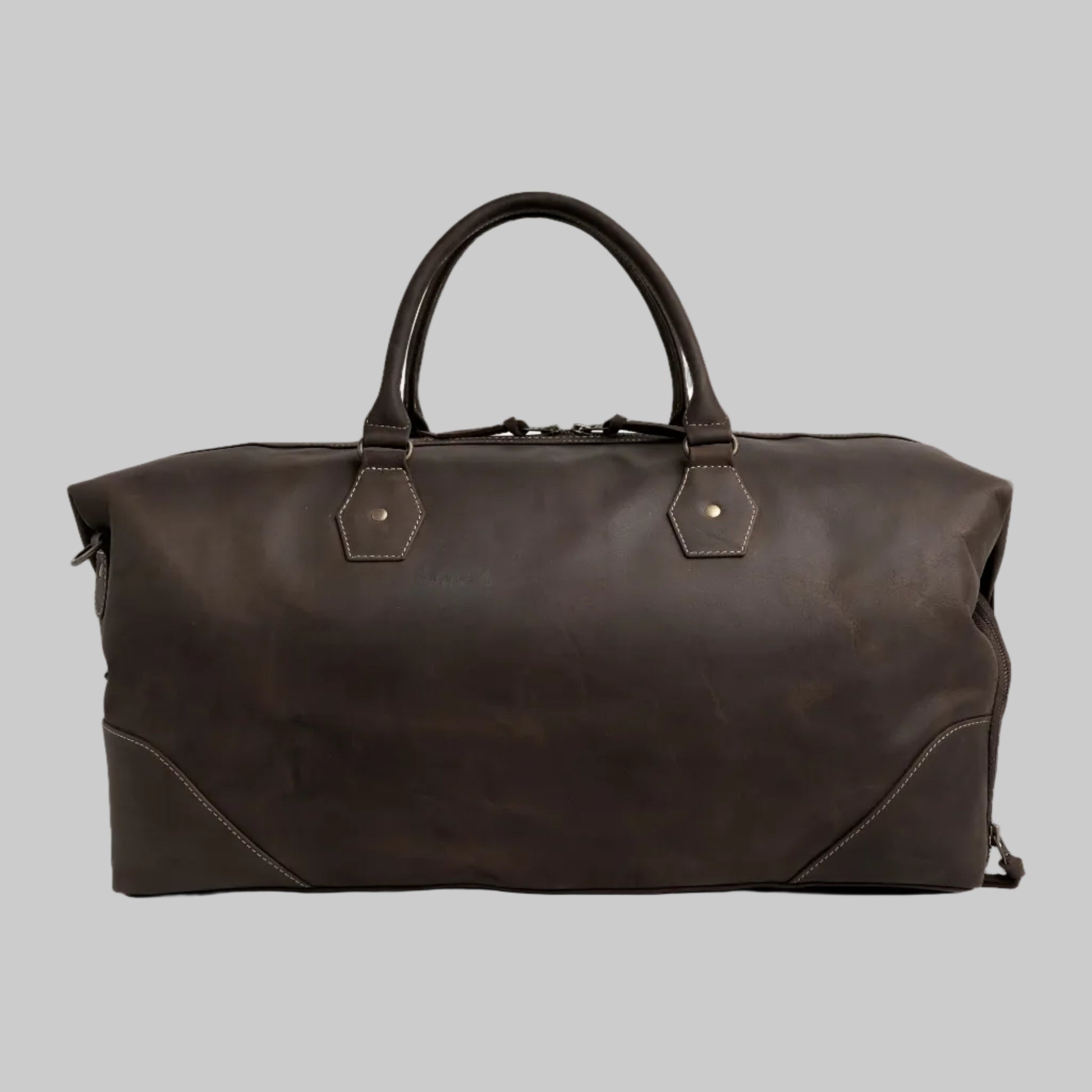 Brown leather duffel bag on a white background