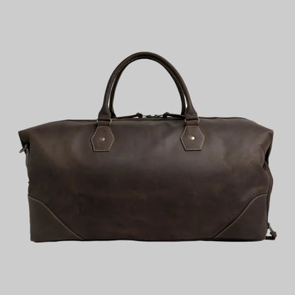 Brown leather duffel bag on a white background