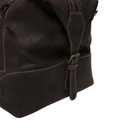 Close-up of a dark brown leather bag with a strap on a white background