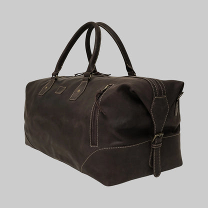 Brown leather duffel bag on a white background