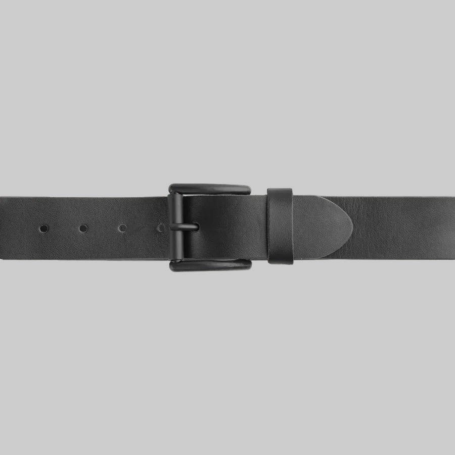 Black leather belt with a buckle on a light gray background