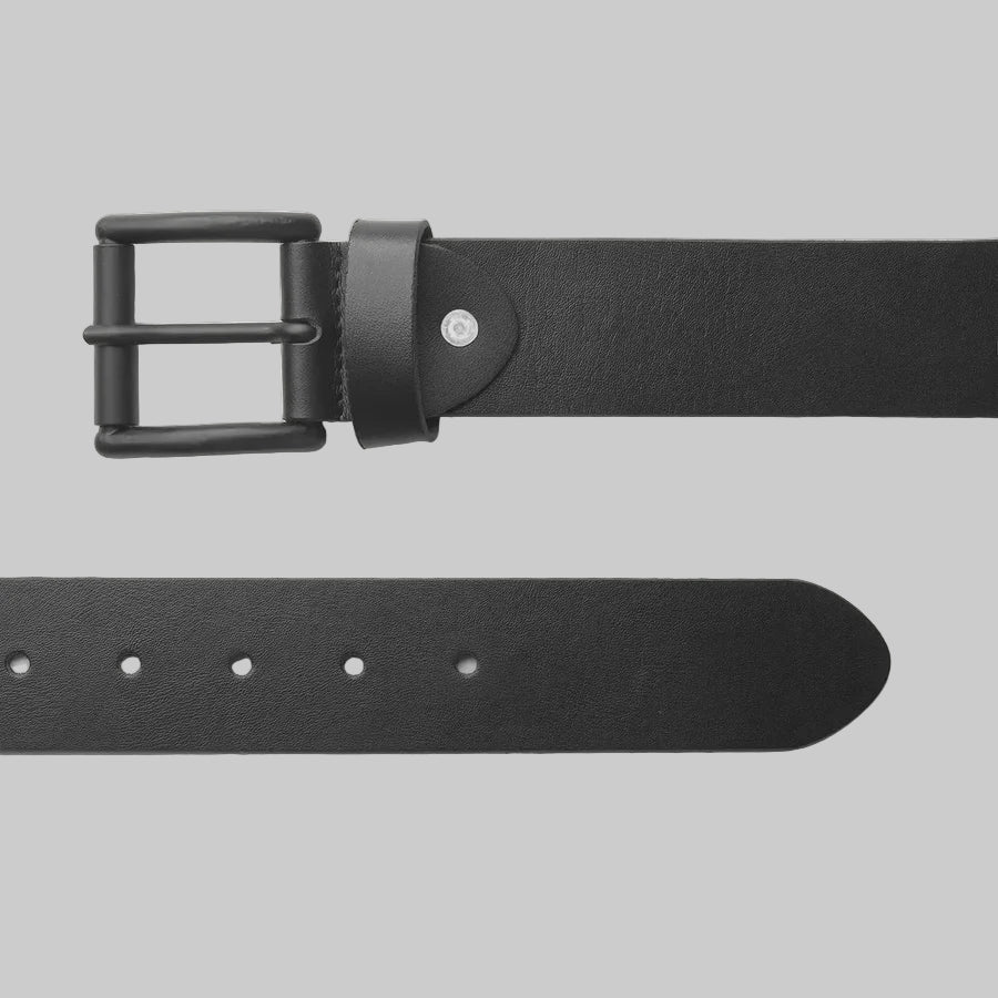 Black leather belt with a black buckle on a light gray background