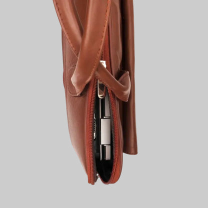 Brown leather bag with a zipper on a white background