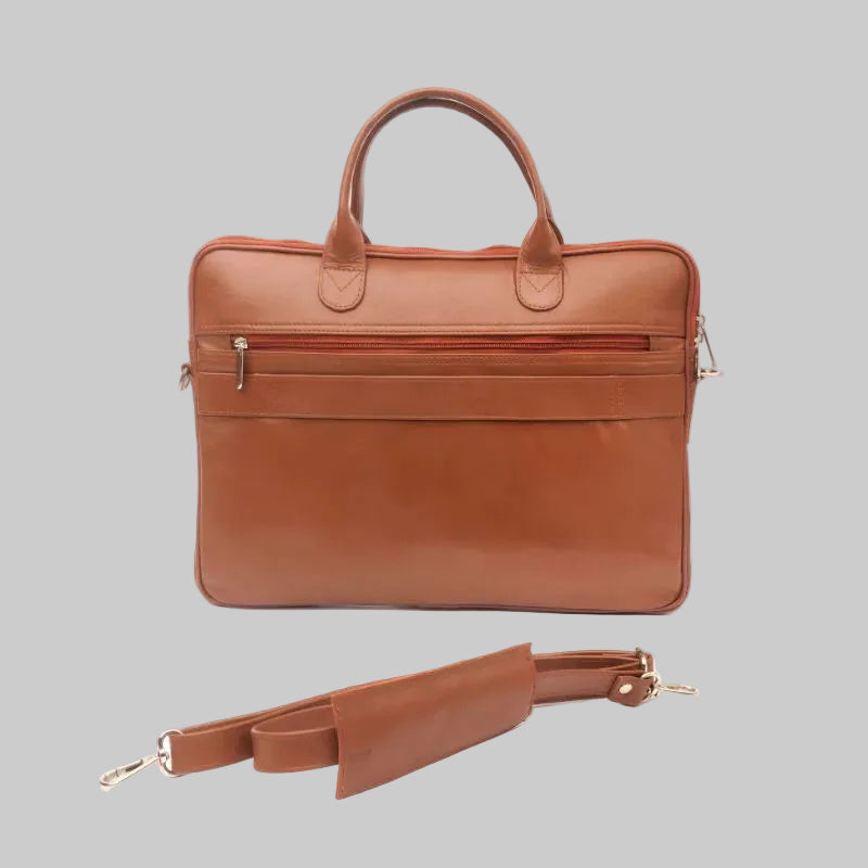 Brown leather briefcase with a detachable strap on a white background