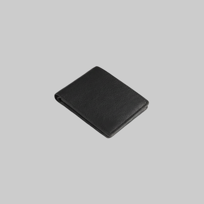 Black leather wallet on a light gray background