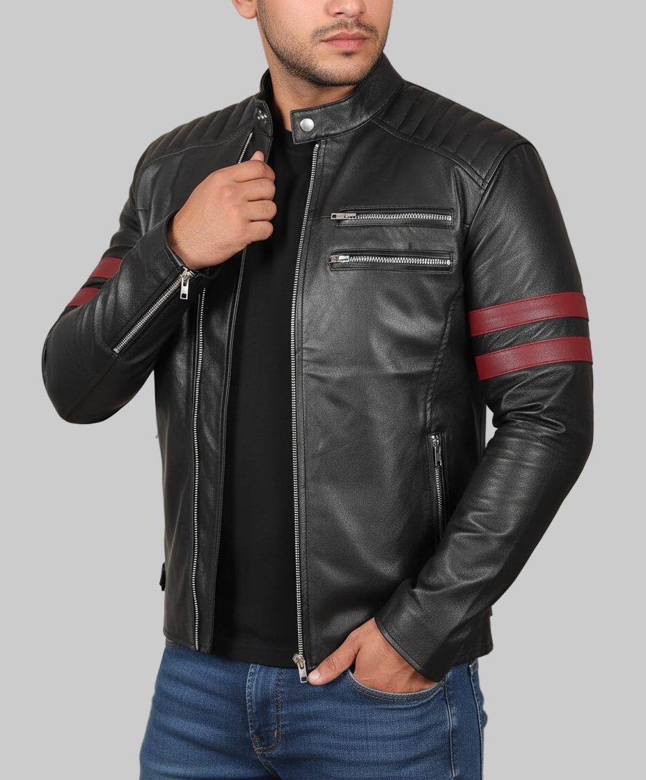 Black leather jacket with red stripes on sleeves worn by a person against a neutral background