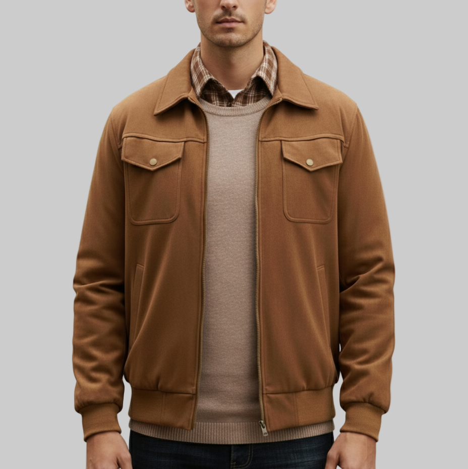 Man wearing a brown jacket over a plaid shirt on a white background