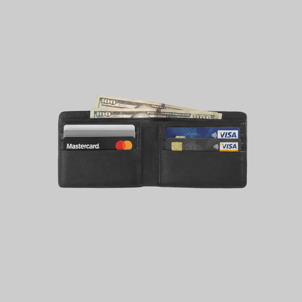 Black wallet with cards and money on a light gray background