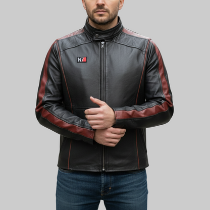 Man wearing a black and red leather jacket with a logo on a blurred street background