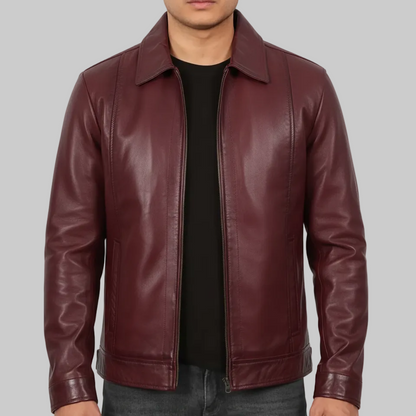 Maroon leather jacket worn by a person on a white background