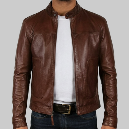 Brown leather jacket worn by a person on a white background
