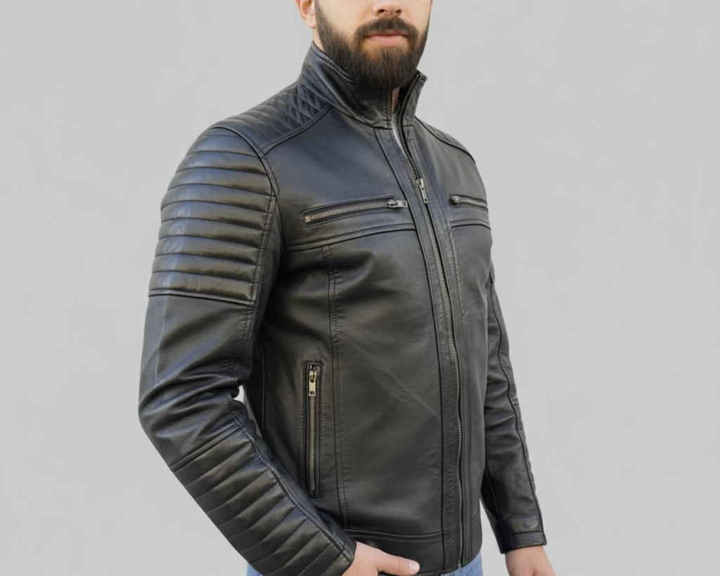 Man wearing a black leather jacket on a gray background