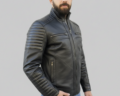 Man wearing a black leather jacket on a gray background