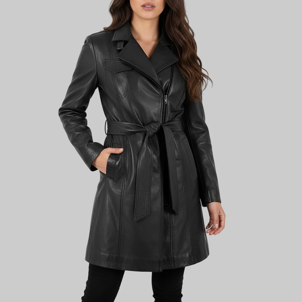 Black leather trench coat worn by a model on a light pink background