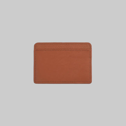 Brown leather cardholder on a light gray background