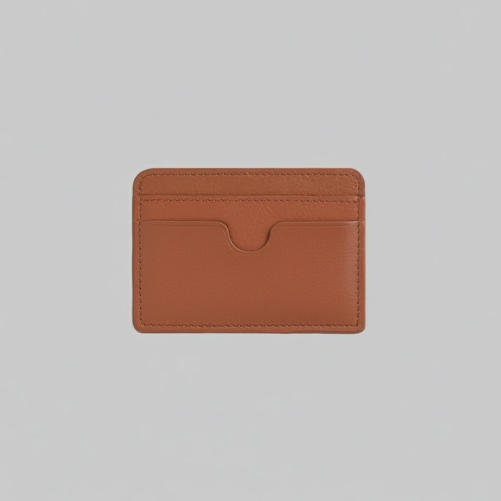 Brown leather cardholder with 'TRUCARRY' branding on a light gray background