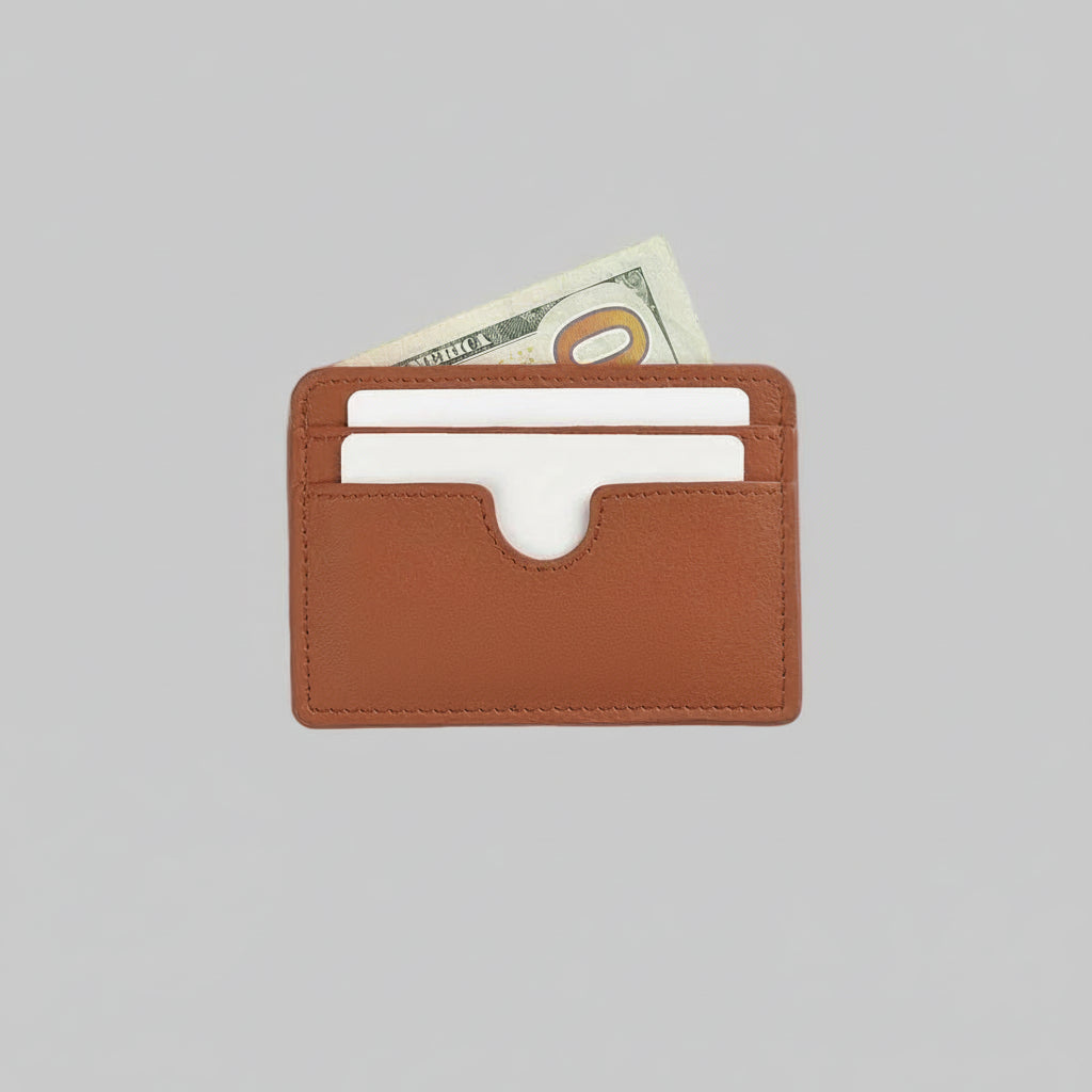 Brown leather cardholder with currency on a light gray background