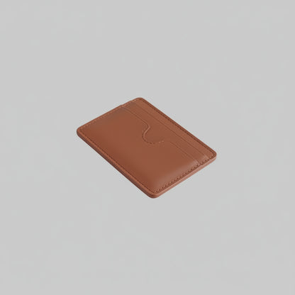 Brown leather cardholder on a light gray background