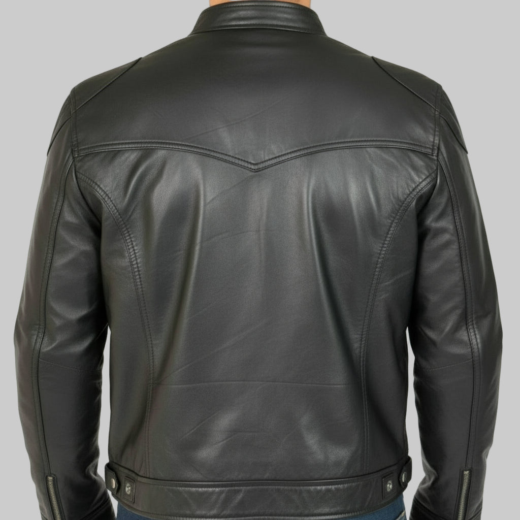 Black leather jacket worn by a person on a white background