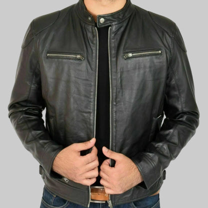 Black leather jacket worn by a person on a white background