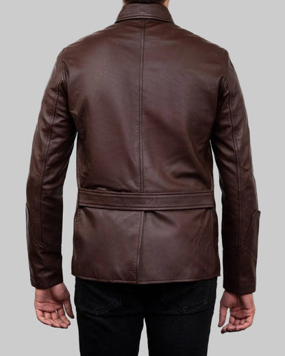 Brown leather jacket worn by a person on a white background
