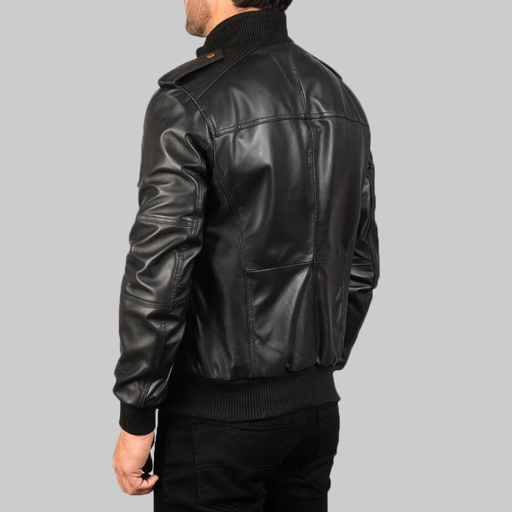Black leather jacket worn by a person on a white background