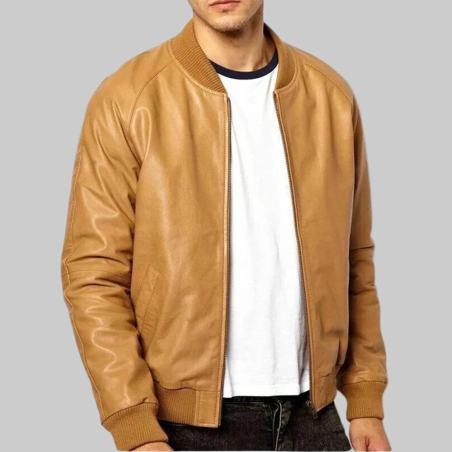 Tan leather bomber jacket worn by a person on a white background