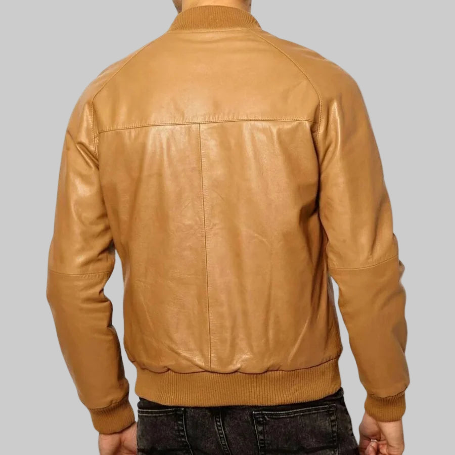 Tan leather jacket on a white background