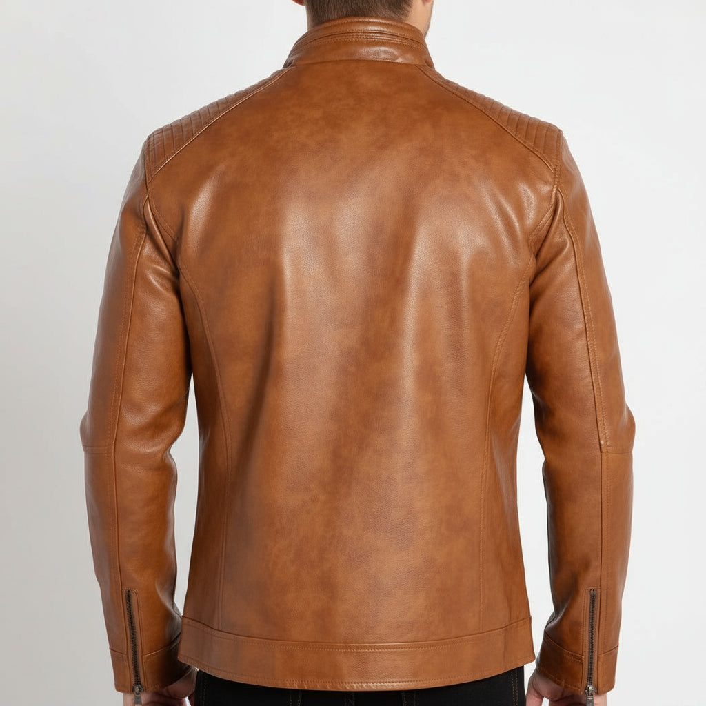 Brown leather jacket worn by a person on a white background