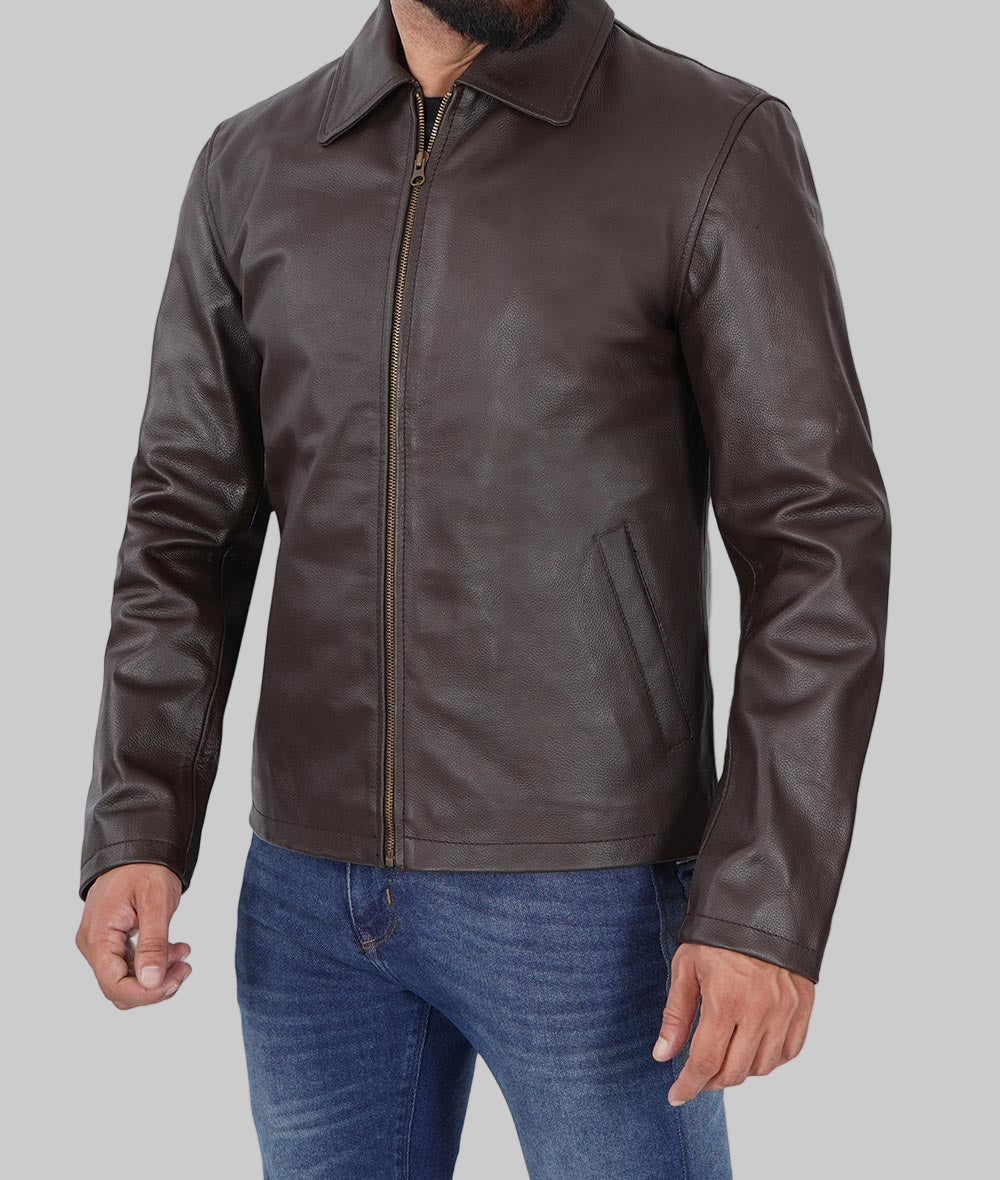 Brown leather jacket worn by a person on a white background