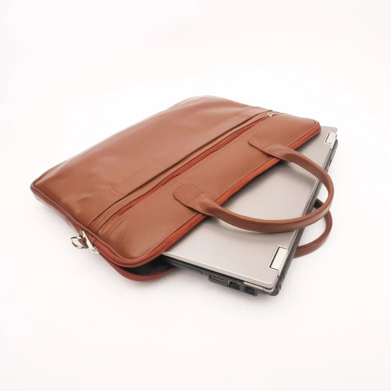 Brown leather laptop bag with a handle on a white background