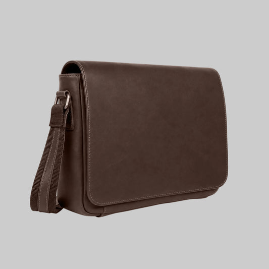 A dark brown leather messenger bag with a matching adjustable shoulder strap, shown from a three-quarters angle against a plain white background.