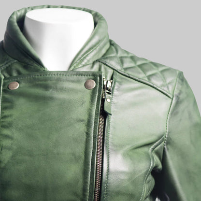 Green leather jacket on a mannequin with a white background