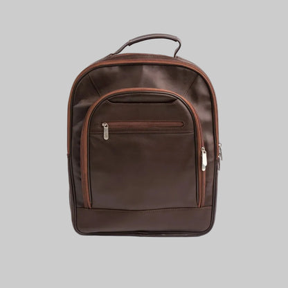A dark brown leather backpack with a top handle, a front zippered pocket, and silver zipper pulls, photographed against a plain white background.