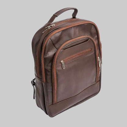A dark brown leather backpack with matching brown trim and silver zipper pulls, shown on a clean white background.