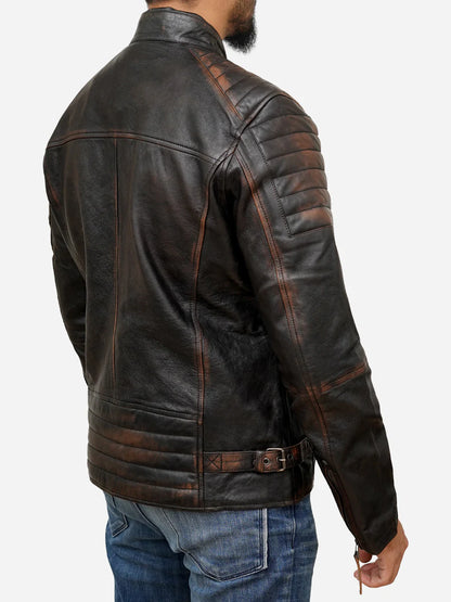 Dark brown leather jacket worn by a person on a white background