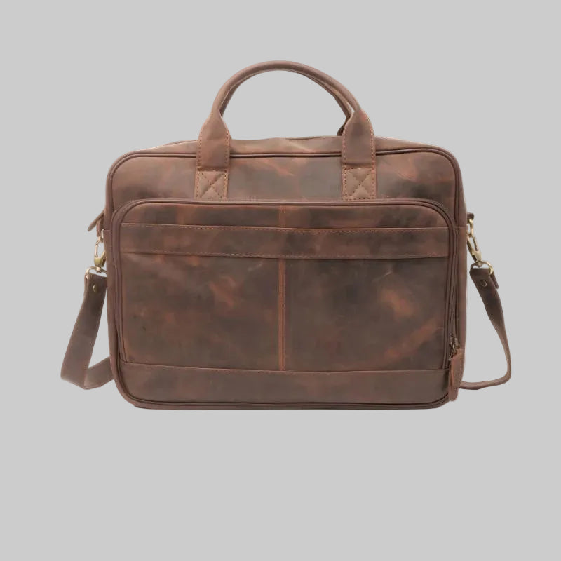 Brown leather briefcase with shoulder strap on a white background