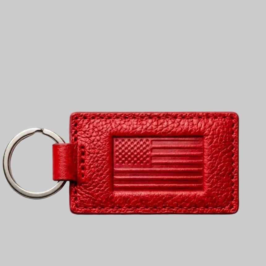 Red leather keychain with American flag design on a gray background